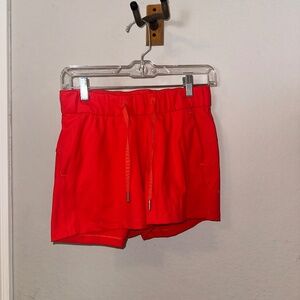 Lululemon Drawstring Highwaisted Shorts in Bright coral red color
